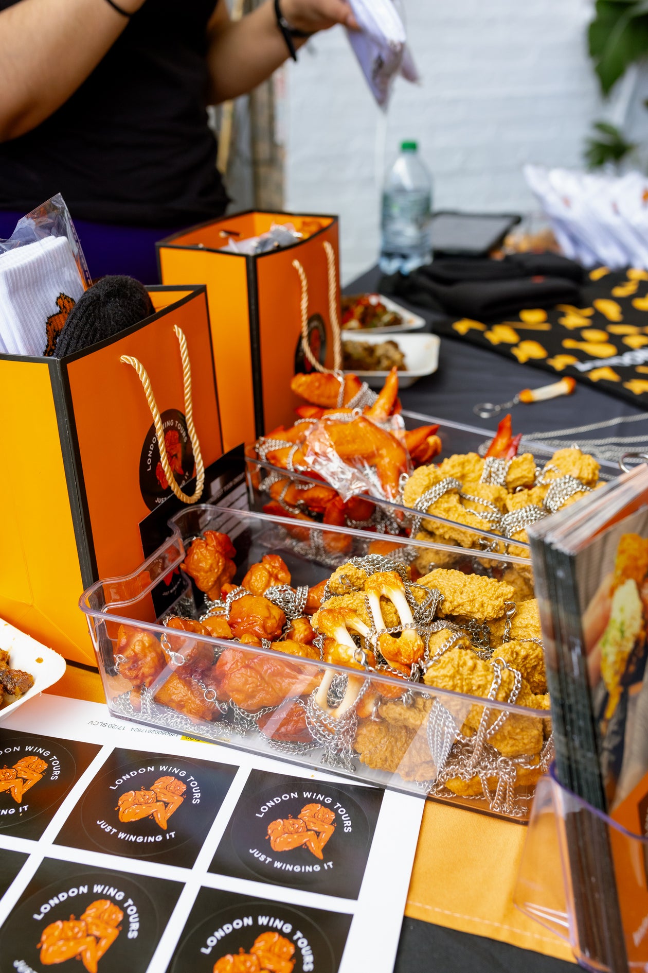 London wing tours' merch at wingjam chicken wing festival London, WingJam London A Festival for Flavor Enthusiasts, WingJam London People Enjoying Every Moment and Every Bite, WingJam London A Gathering for Chicken Wing Fans, WingJam London The Best Chicken Wing Event for Friends, WingJam London A Celebration of Delicious Wings and Good Times