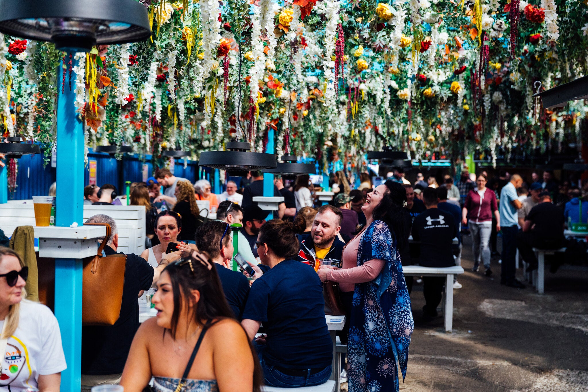 People Loving the WingJam Festival in London, WingJam London A Must-Visit for Chicken Wing Lovers, Enjoying Flavor-Packed Chicken Wings at WingJam London, WingJam London Best Place to Eat Chicken Wings, WingJam London Festival Crowds Enjoying Every Bite