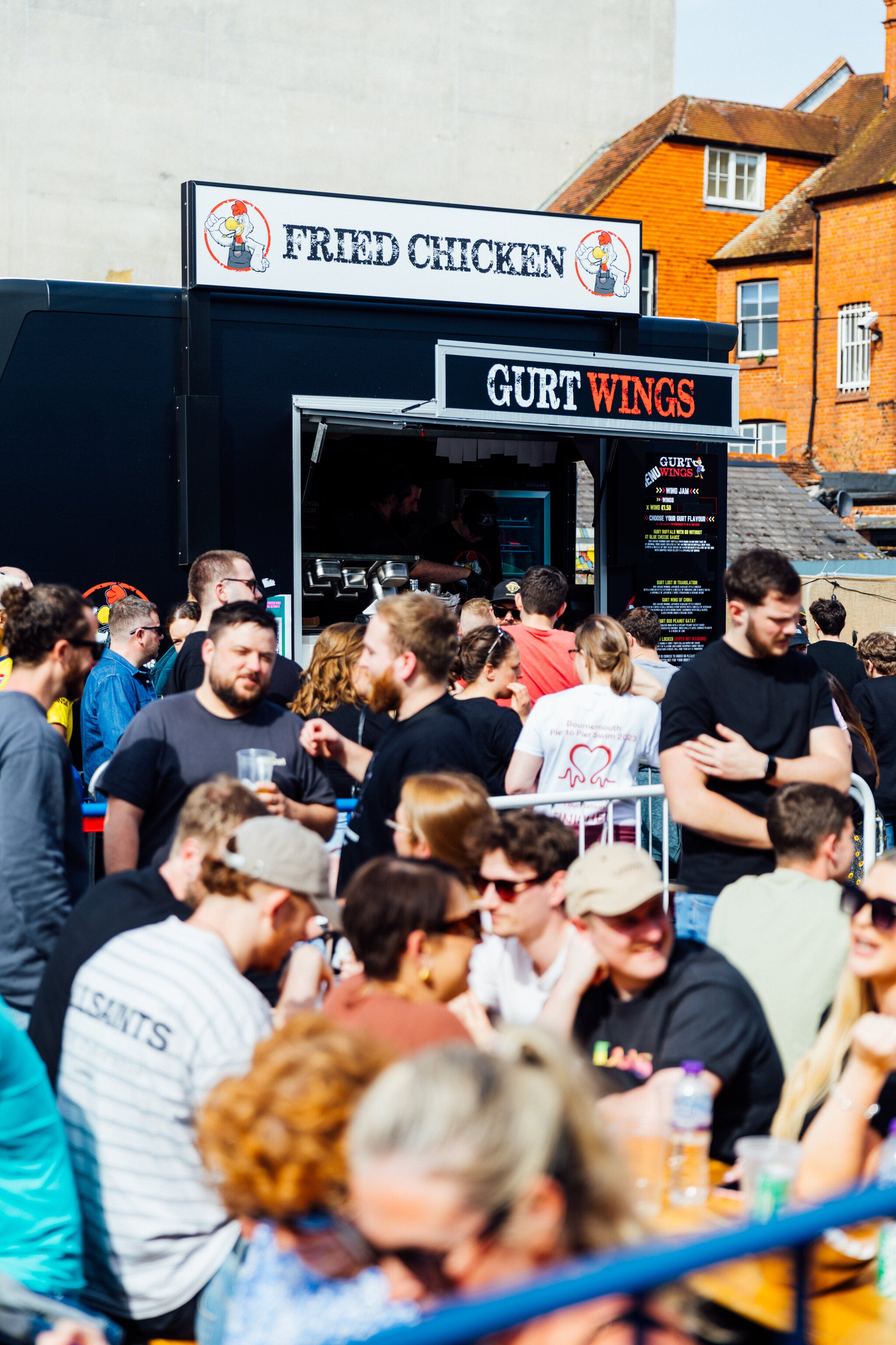Guests Relishing Every Bite at WingJam London, WingJam London The Ultimate Chicken Wing Experience, WingJam London Where Crowds Enjoy the Best Wings, Friends Gather at WingJam for Delicious Chicken Wings