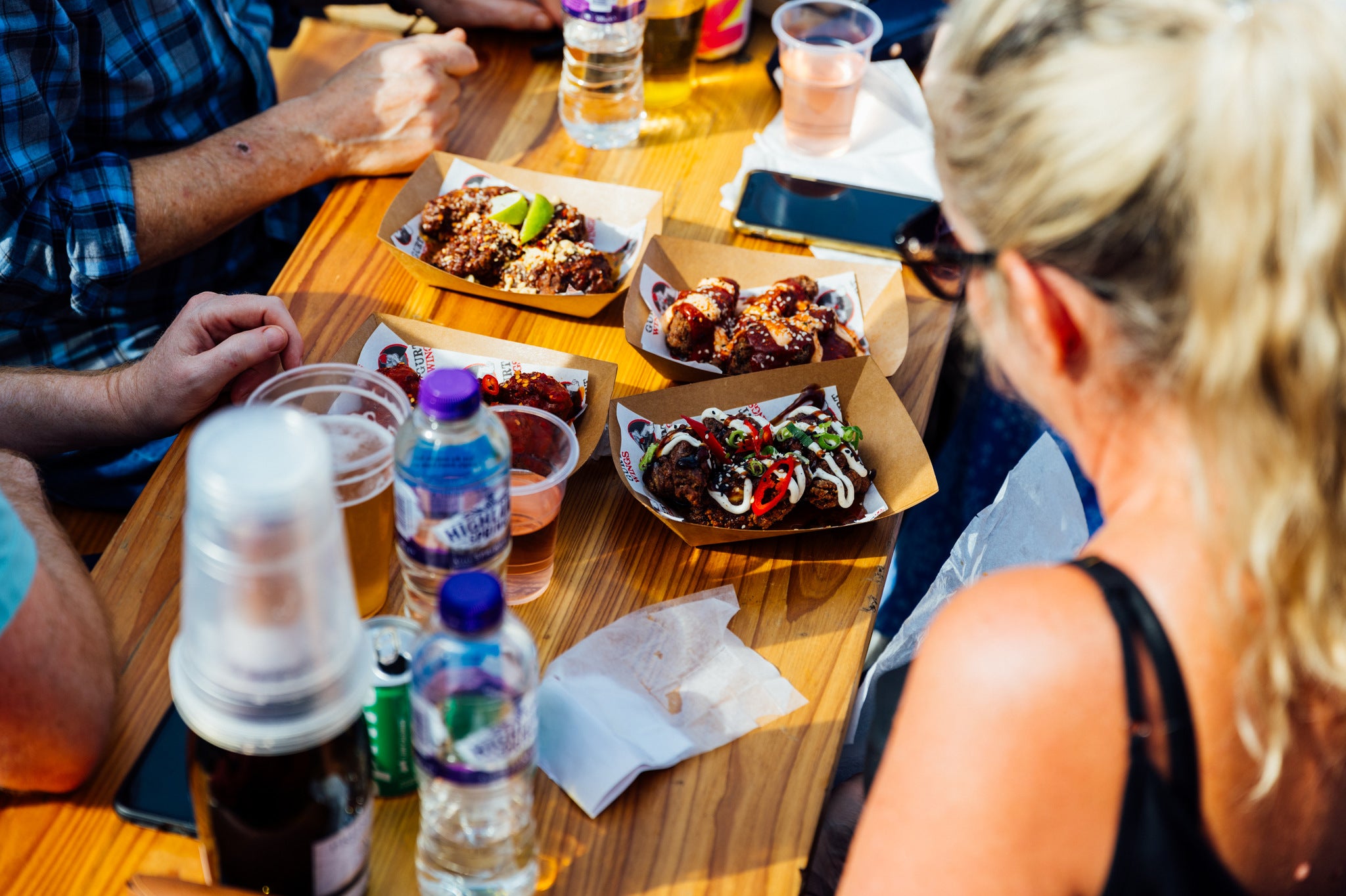 WingJam Reading Friends Enjoying Tasty Chicken Wings, WingJam London Where People Feast on Flavorful Wings, London’s WingJam Festival A Must for Food Lovers, WingJam London People Savoring Every Wing Bite