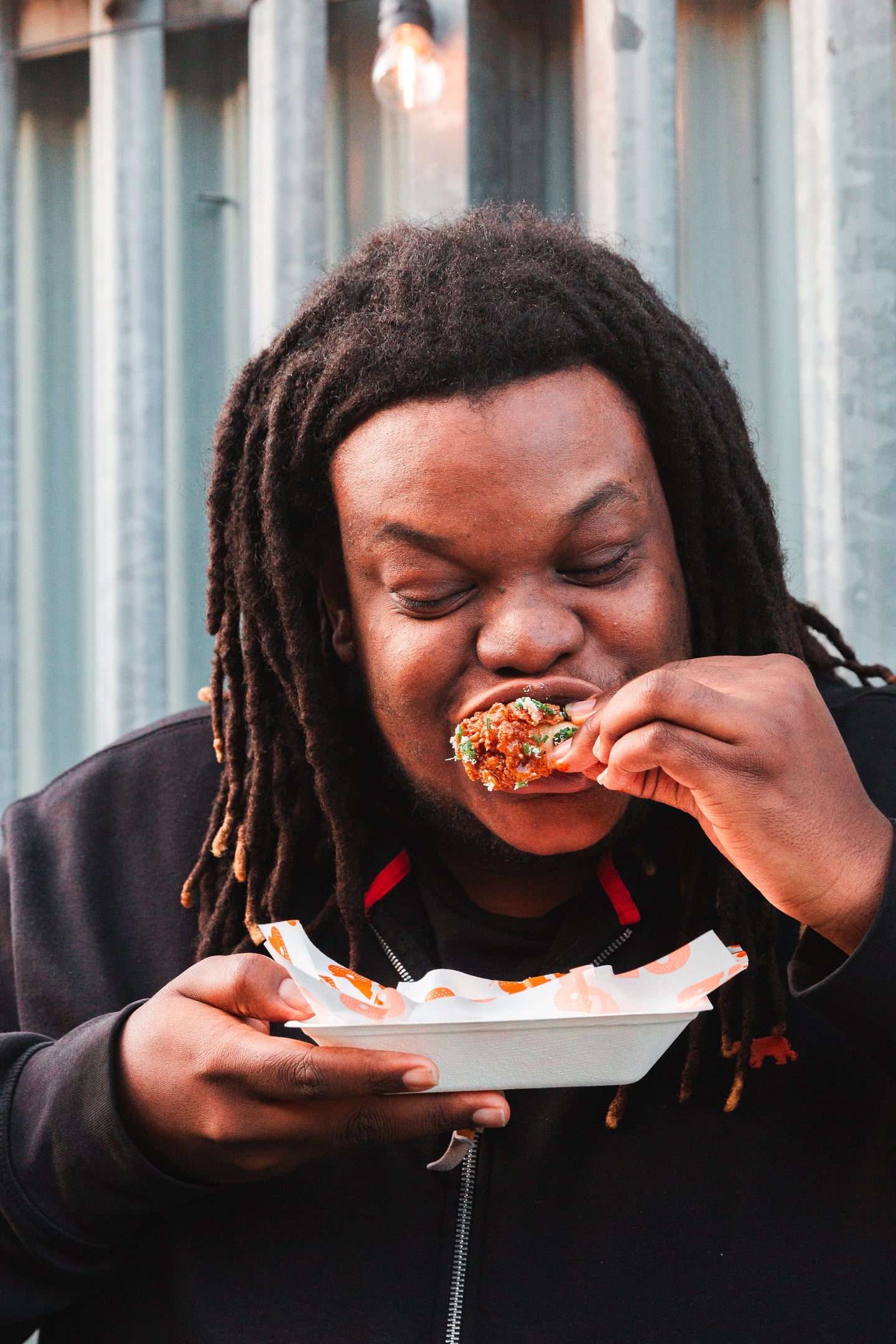 a guy really enjoys his meal at wingjam 2024, WingJam London Friends Enjoying Every Flavorful Wing Together, WingJam London A Celebration of Flavor and Friendship with Wings, WingJam London The Best Place to Enjoy Chicken Wings and Good Company, WingJam London A Fun Event for Wing Lovers and Friends
