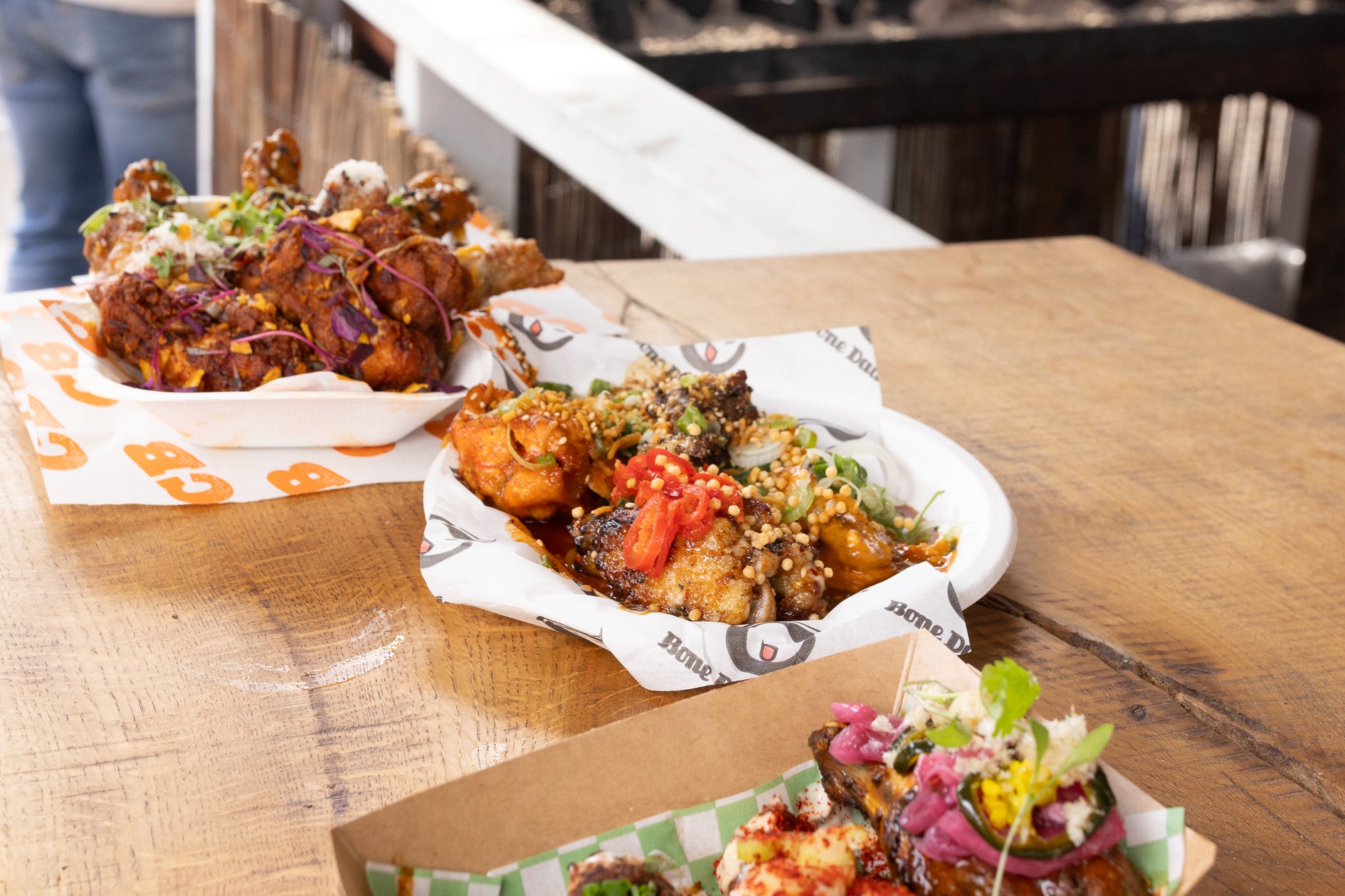 amazing chicken wings served at wingjam 2024, WingJam London Friends Indulging in Delicious Chicken Wings, WingJam London People Enjoying Tasty Wing Dishes, WingJam London A Festival of Fun and Flavorful Wings, WingJam London The Best Event for Chicken Wing Lovers