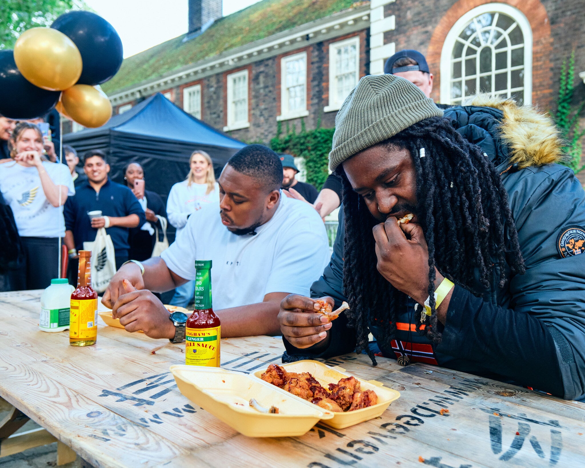 the hottest wing contest at wingjam, Attendees Eating at WingJam London, WingJam London Top Chicken Wing Event, London Party Events WingJam Experience