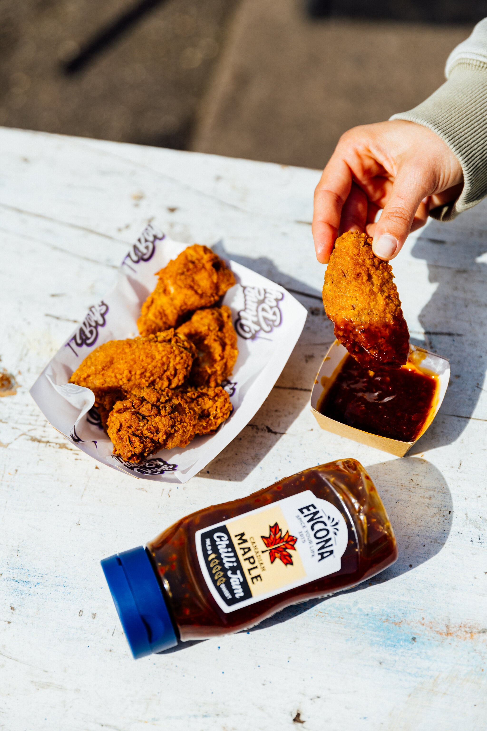 hungry boys' wings paired with encona sauce at wingjam, WingJam 2024 Best Chicken Wings in London, Family-Friendly Festivals London WingJam, WingJam Best Chicken Wings London 2024